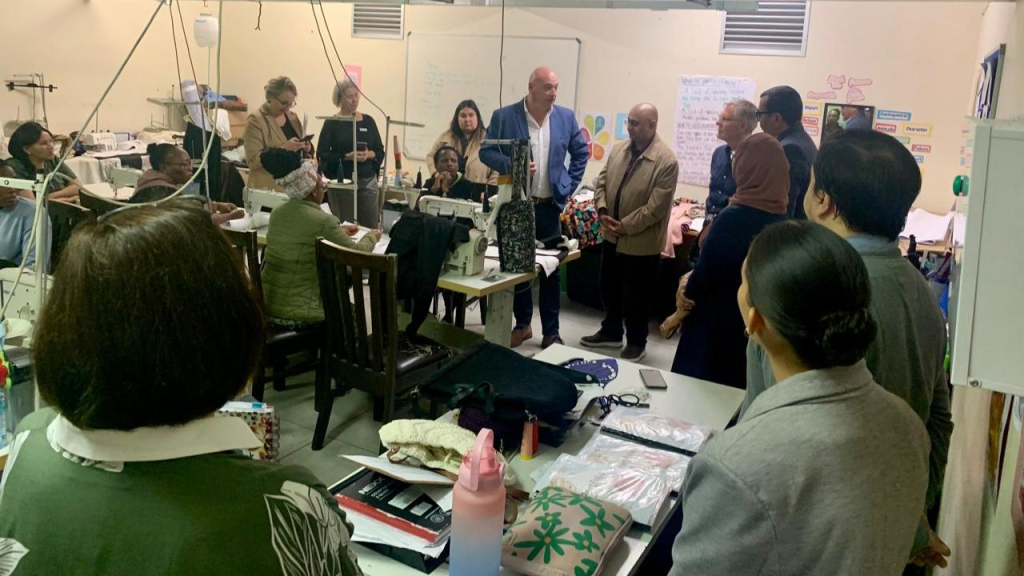 Alderman James Vos visiting the Stitch Ahead Project.